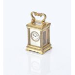 A brass and seed pearl miniature carriage clock