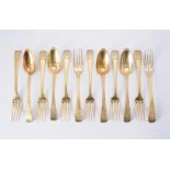 A set of eight French silver gilt dessert forks and four dessert spoons