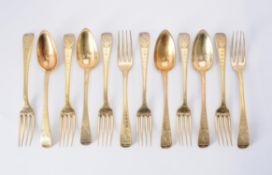 A set of eight French silver gilt dessert forks and four dessert spoons