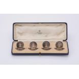 A cased set of four silver circular menu holders by Asprey & Co. Ltd.