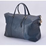 An unsigned blue faux crocodile bag