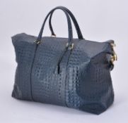 An unsigned blue faux crocodile bag