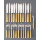 Y A set of eleven silver fish knives and twelve forks by Atkin Bros.