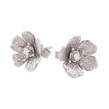 A pair of 18 carat white gold and diamond flower head ear studs