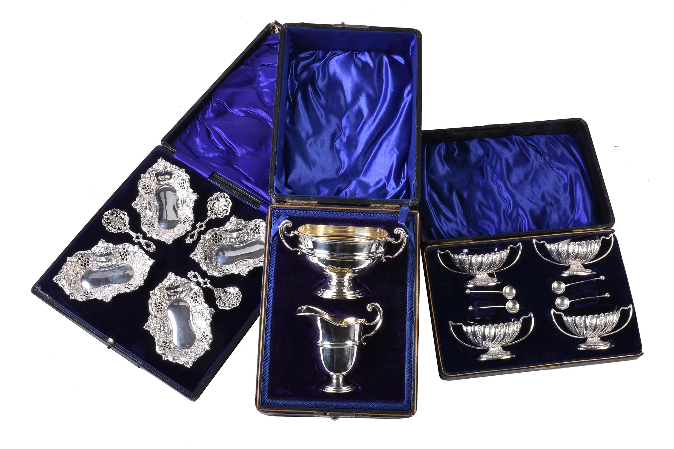 Three cased silver sets