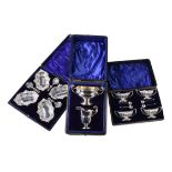 Three cased silver sets