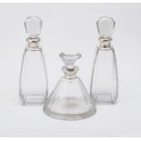 Three silver mounted decanters with silver collars