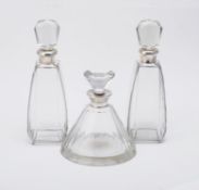 Three silver mounted decanters with silver collars