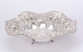 An Egyptian silver coloured shaped circular bowl