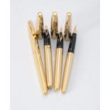 Sheaffer, four gold plated fountain pens