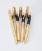 Sheaffer, four gold plated fountain pens