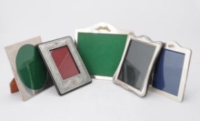 A collection of silver mounted photo frames