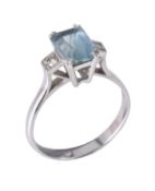 An aquamarine and diamond three stone ring