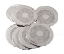 A matched set of ten silver mounted circular place mats