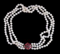 A three row cultured pearl and garnet necklace