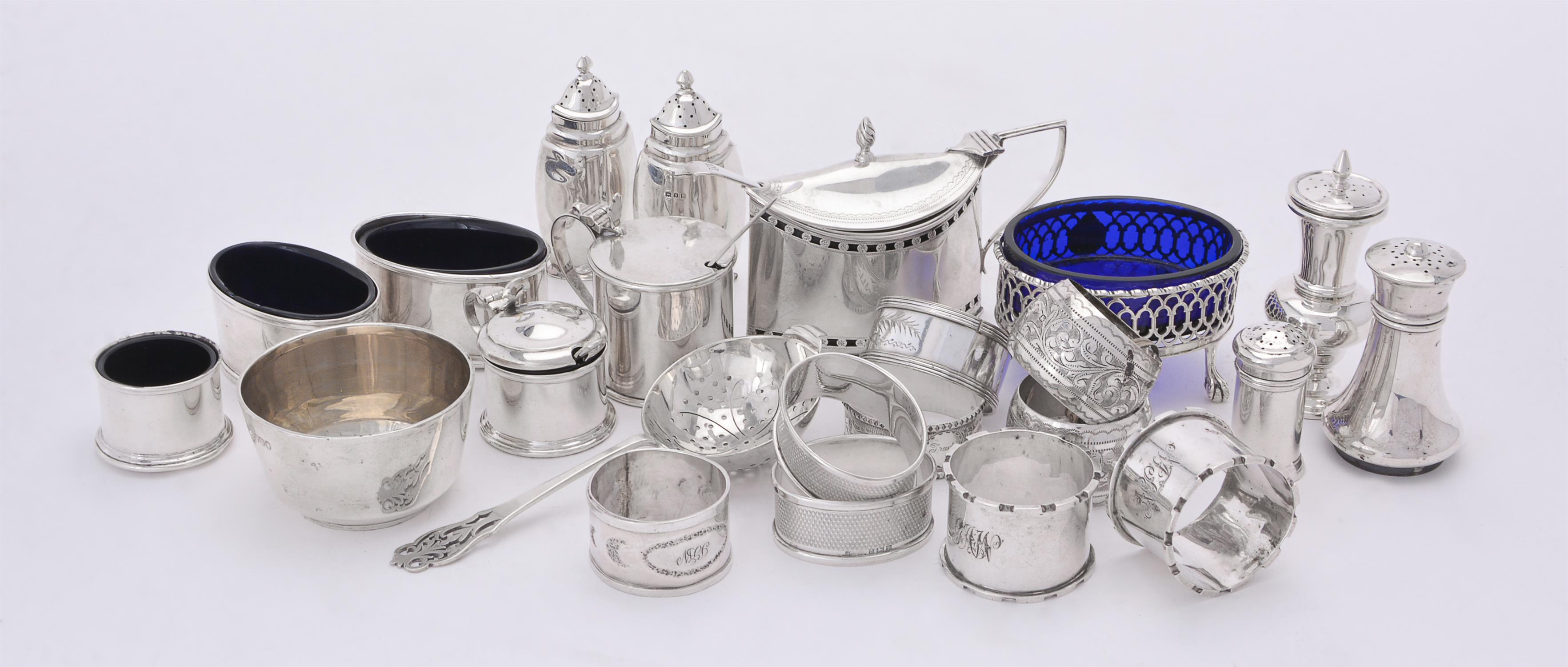 A collection of silver cruet items