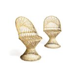 A pair of white painted wicker side chairs