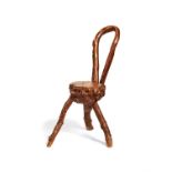 A rustic bentwood and natural form chair
