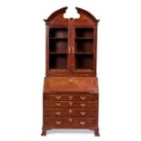 A fine George II walnut crossbanded mahogany bureau cabinet