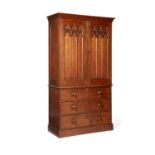 A Victorian oak Gothic Revival linen press