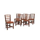A set of six late George III elm dining chairs