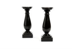 A pair of Victorian slate or Derbyshire Black Ashford marble turned candle holders