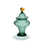 An Italian green glass covered vase with lemon finial