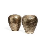 A pair of Indian silvered brass repoussé vases