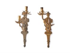 A pair of Northern European gilt brass twin light wall appliques