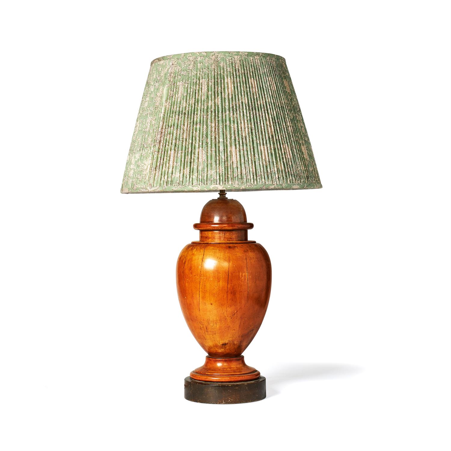 A turned fruitwood urn fitted as a table lamp