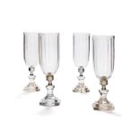 A set of four cut glass and metal mounted storm shades in Regency style