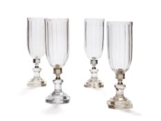 A set of four cut glass and metal mounted storm shades in Regency style