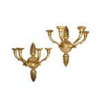 A pair of French gilt bronze four light wall appliques in Charles X taste