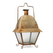 A white painted wrought and sheet iron and glazed hanging storm lantern