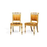 A pair of late George III white painted and parcel giltwood side chairs