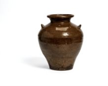 A provincial brown Chinese two handled pottery vase