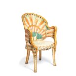 An Indian white and polychrome painted wood armchair in Egyptian Revival taste