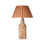 A shell encrusted bottle fitted as a table lamp