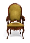 An Italian walnut and upholstered armchair