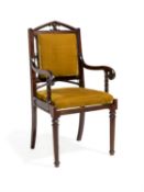 A George IV laburnum and velvet upholstered armchair in Gothic taste