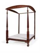 A George IV mahogany and pine four poster bed frame