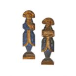 A pair of painted and parcel gilt oak figural furniture mounts in late 17th century style