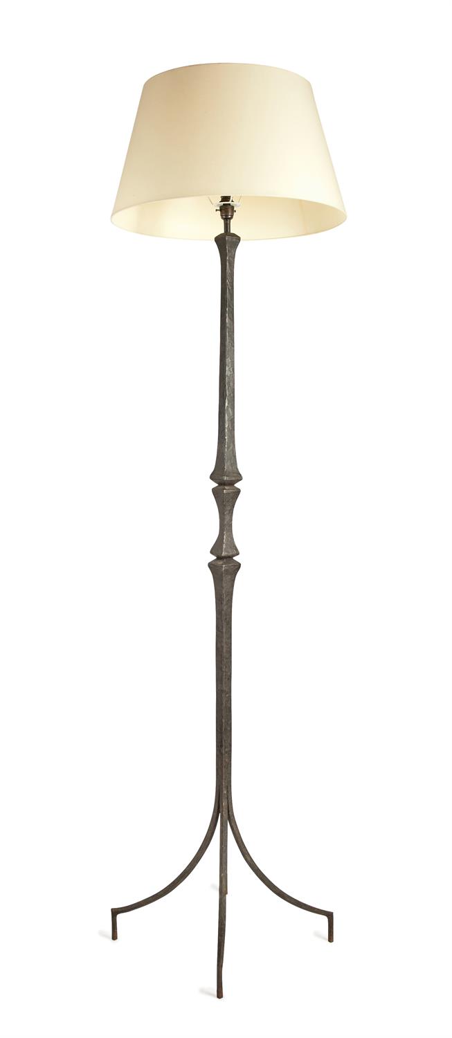 A wrought iron standard lamp