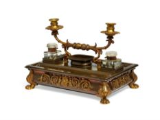 A large Regency gilt and patinated bronze and brass desk stand