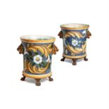 A matched pair of fine French enamelled cast iron jardinieres by E. Paris & Cie