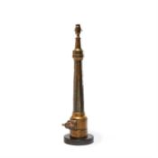 A brass firehose nozzle by John Morris & Sons refitted as a table lamp