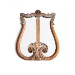 A limed oak wall mirror in the form of a lyre