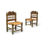 A pair of Spanish green painted and parcel giltwood side chairs