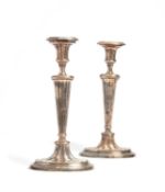 A pair of Sheffield plate candlesticks