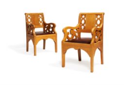 A pair of oak armchairs